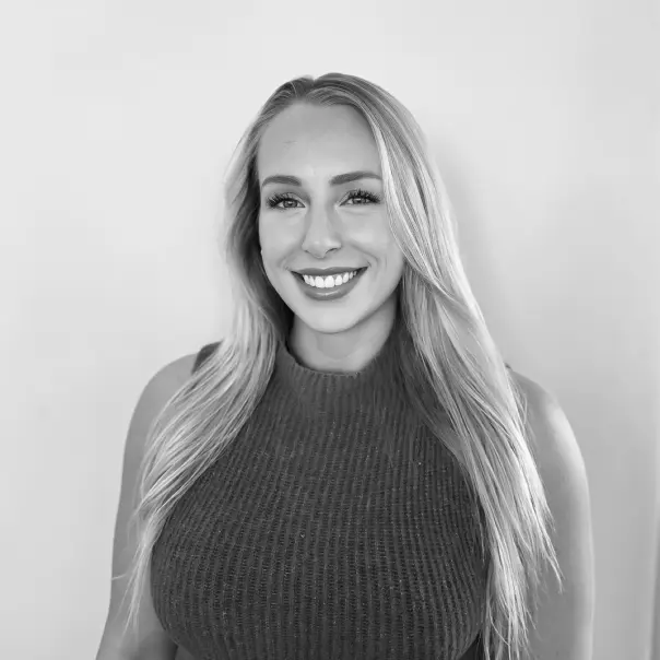 Female fitness coach headshot in black and white